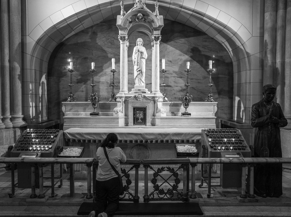 An ornate church altar framed by a stone arch