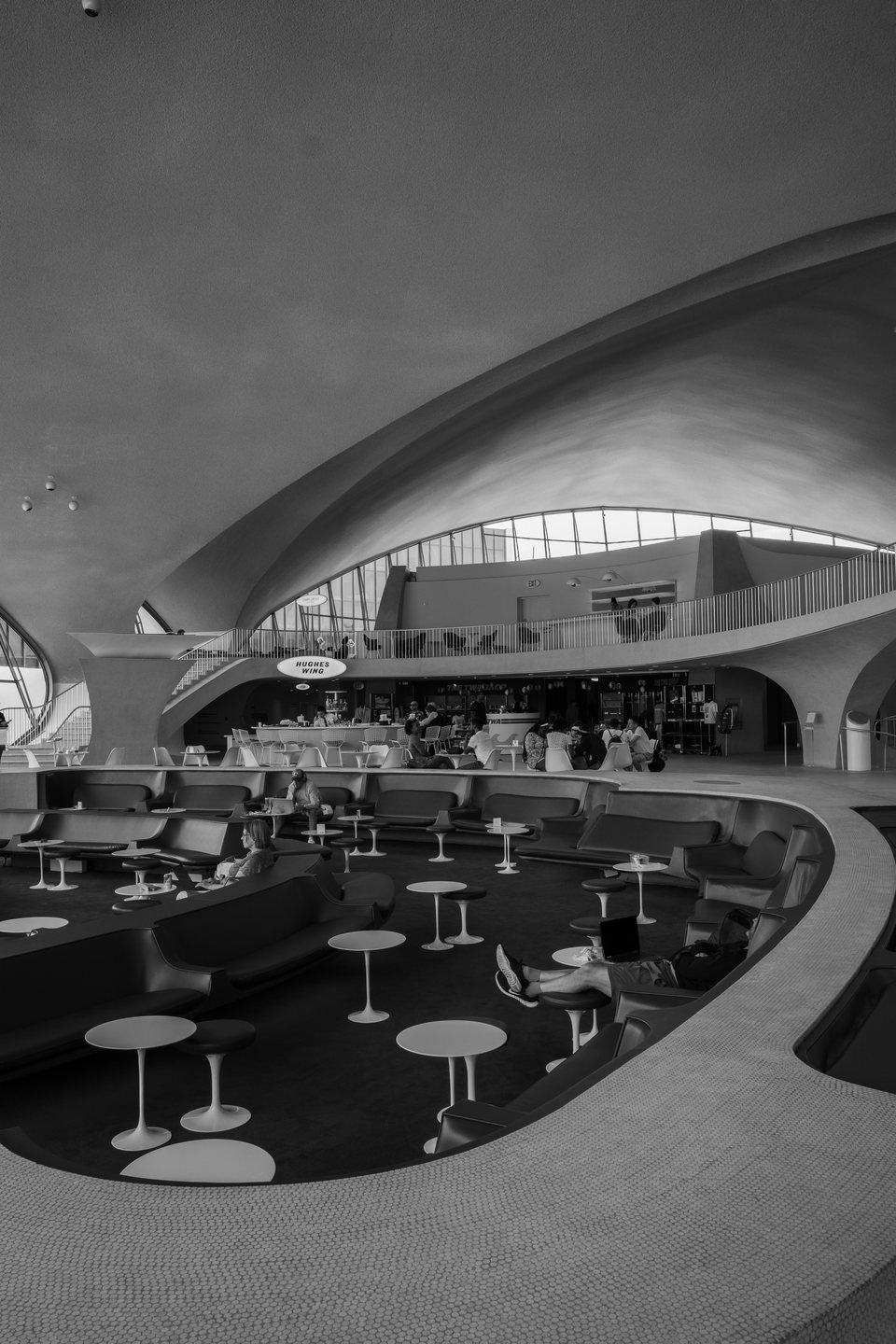 Circular seating beneath the vaulted roof of the TWA Flight Center