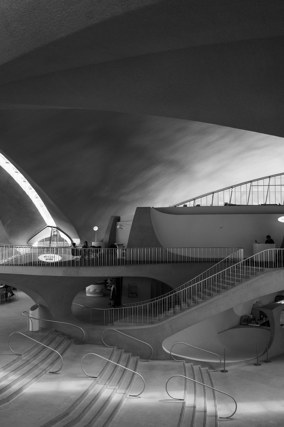 Curving ramps and sunlit concrete inside the TWA Flight Center